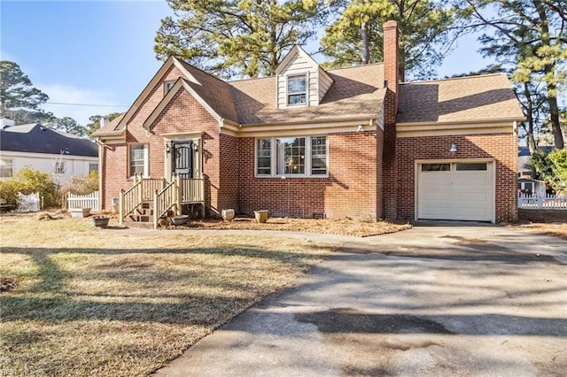 new england style home with a garage and a front yard