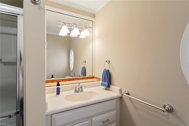 bathroom featuring crown molding and vanity