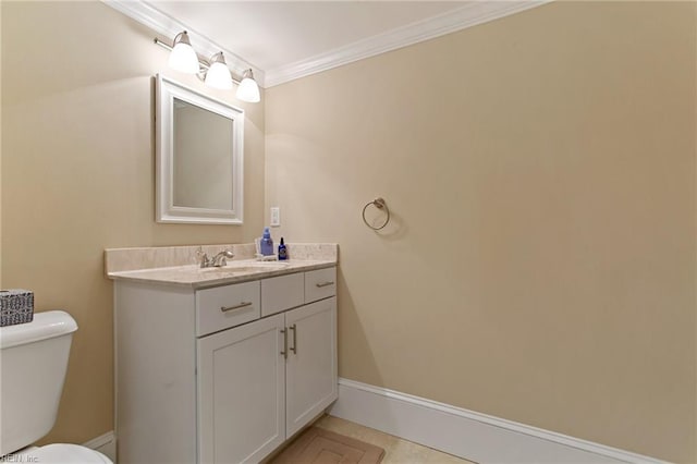 bathroom featuring vanity, ornamental molding, tile patterned floors, and toilet