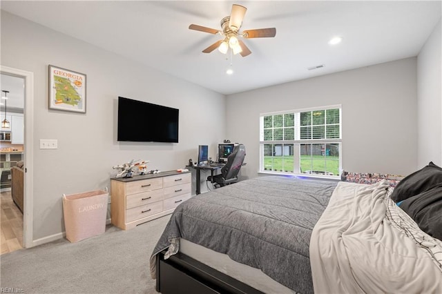 carpeted bedroom featuring ceiling fan