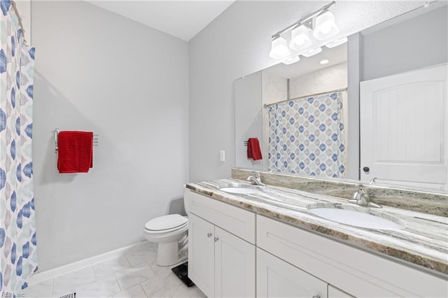 bathroom with vanity, toilet, and walk in shower