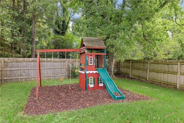 view of jungle gym with a lawn