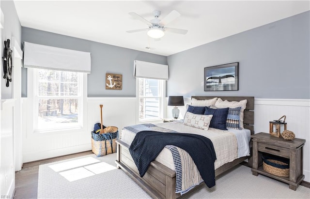 bedroom featuring ceiling fan and light hardwood / wood-style flooring