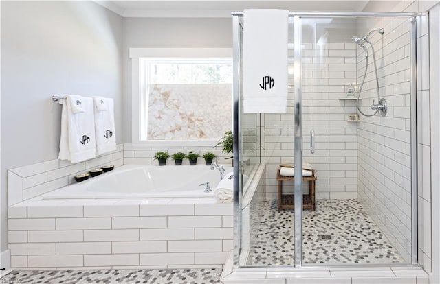 bathroom featuring separate shower and tub