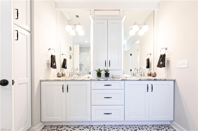 bathroom featuring vanity and a shower with shower door