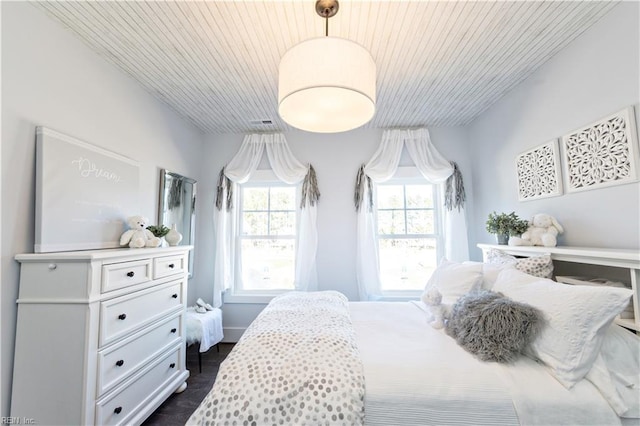 bedroom featuring wood ceiling and dark wood-type flooring