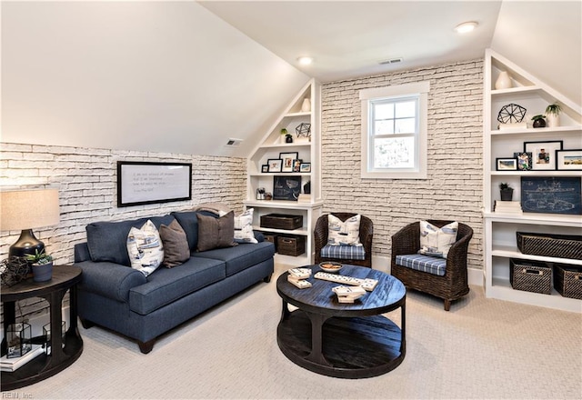 carpeted living room with lofted ceiling and built in features