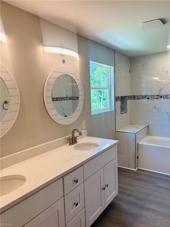 2084 Millville Rd, Chesapeake, VA 23323 - full bath with double vanity and wood finished floors