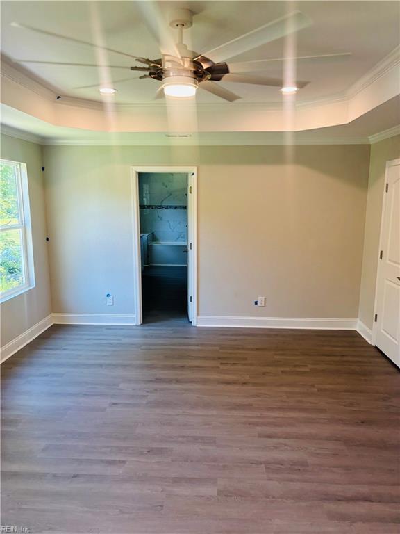 2084 Millville Rd, Chesapeake, VA 23323 - spare room with wood finished floors, crown molding, a tray ceiling, and a ceiling fan