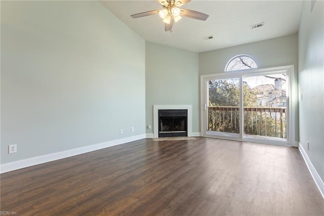 unfurnished living room featuring hardwood / wood-style flooring and ceiling fan