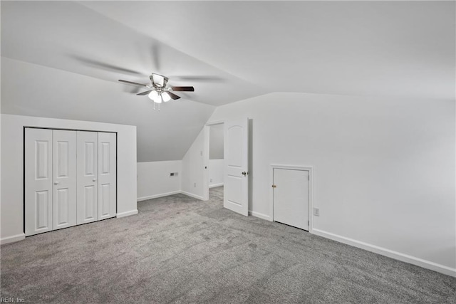 additional living space with carpet floors, vaulted ceiling, and ceiling fan