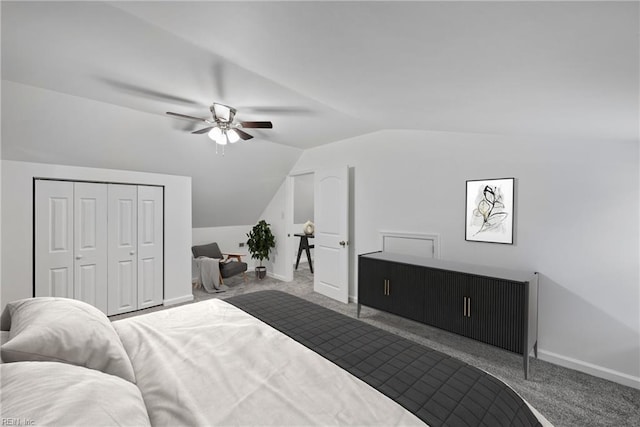 bedroom with lofted ceiling, light colored carpet, a closet, and ceiling fan