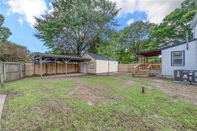 view of yard featuring an outbuilding and central air condition unit