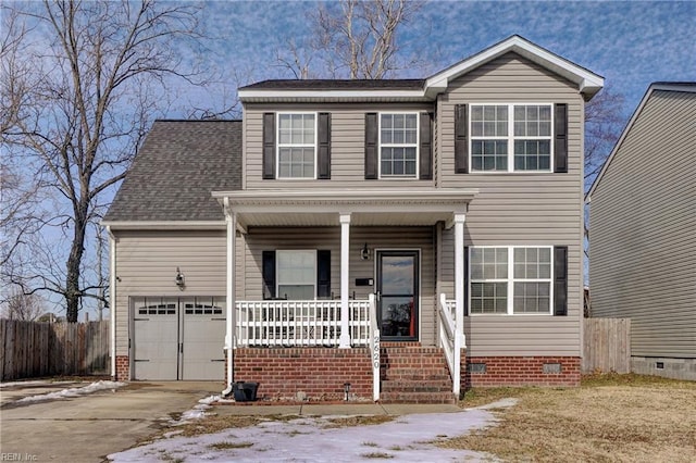 view of front facade featuring a garage and covered porch