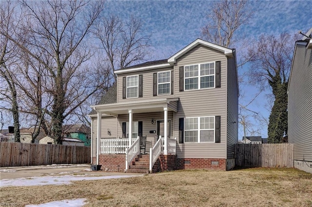 view of front of house featuring a front lawn and covered porch