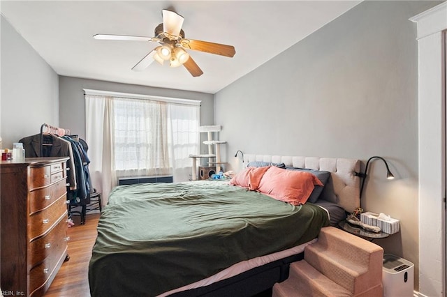 bedroom featuring wood-type flooring and ceiling fan