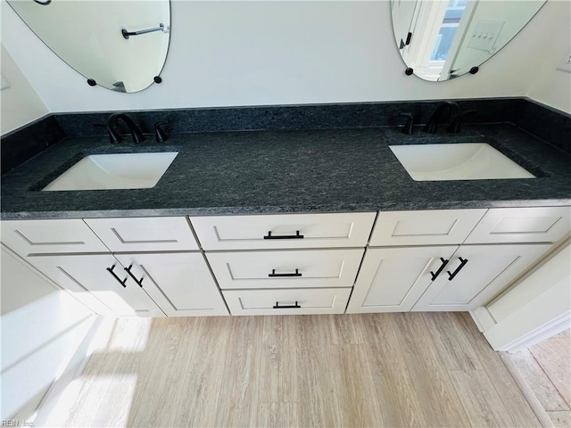 bathroom featuring vanity and hardwood / wood-style flooring