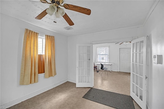 interior space featuring french doors, ceiling fan, and crown molding