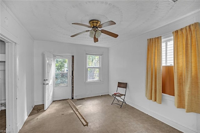 interior space featuring plenty of natural light and ceiling fan