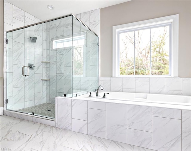 bathroom featuring independent shower and bath