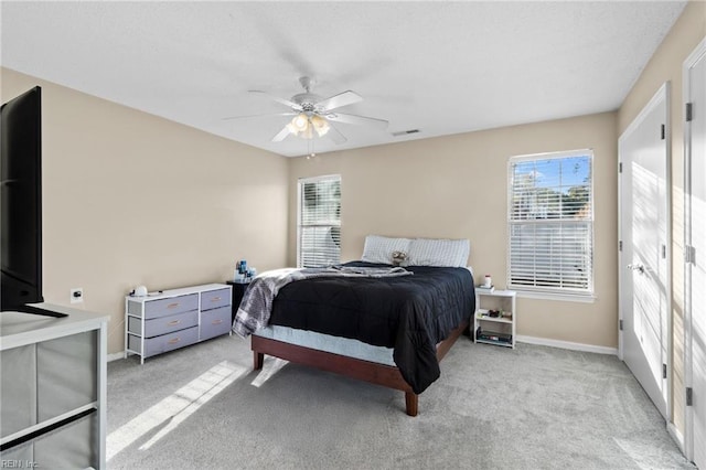 carpeted bedroom with ceiling fan