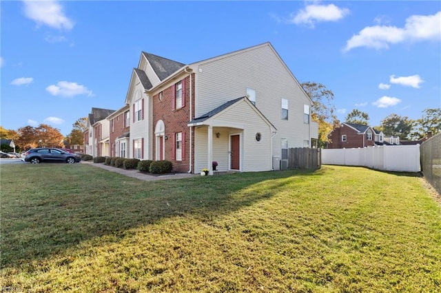 view of side of home featuring a yard