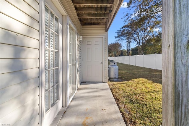 doorway to property with a yard