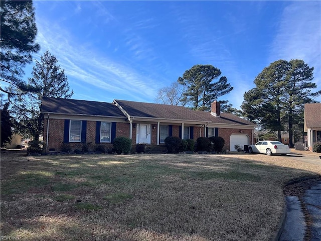 ranch-style home with a garage and a front yard