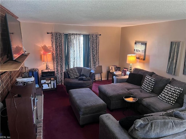 living room featuring a textured ceiling and dark colored carpet