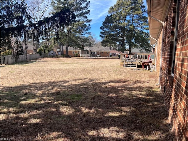 view of yard with a wooden deck