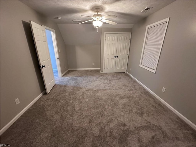 additional living space featuring lofted ceiling, ceiling fan, carpet floors, and a textured ceiling