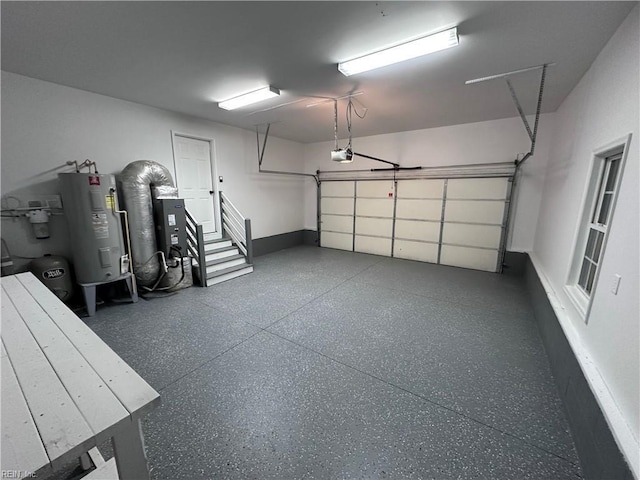 garage featuring a garage door opener and water heater