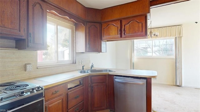 kitchen featuring tasteful backsplash, dishwasher, sink, electric range, and kitchen peninsula