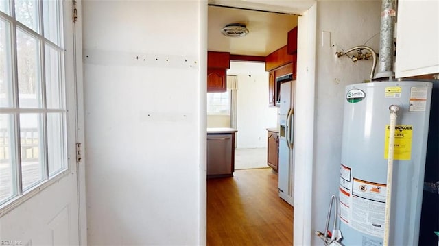 utility room featuring gas water heater