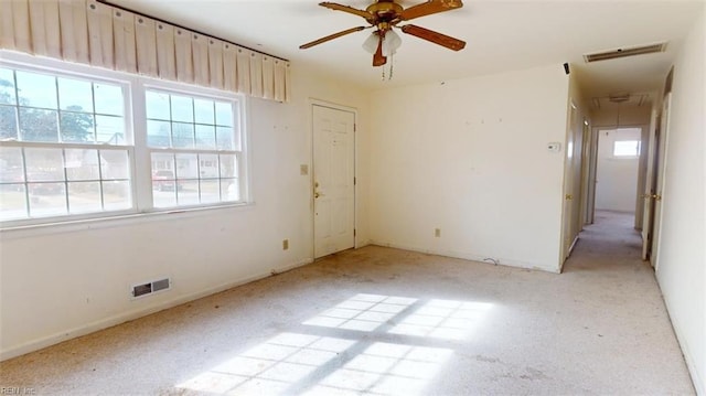 unfurnished room with ceiling fan