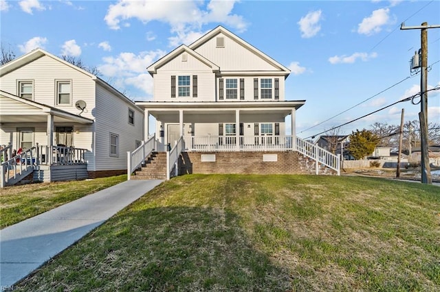 view of front of home featuring covered porch and a front lawn