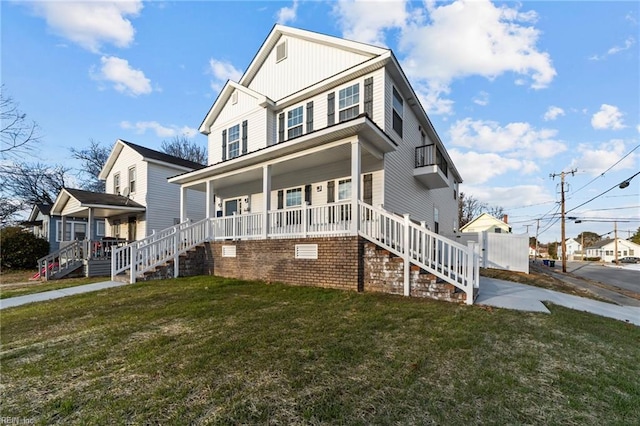 view of front of property featuring a porch and a front lawn