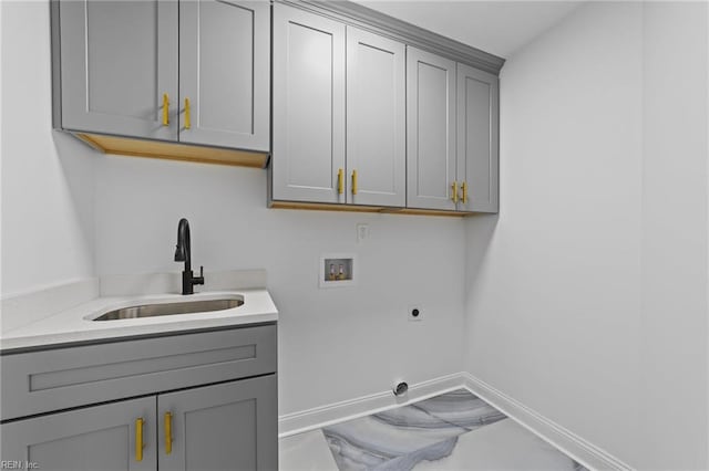 laundry room with cabinets, hookup for an electric dryer, hookup for a washing machine, and sink