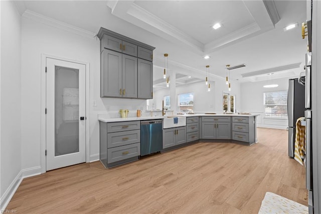 kitchen featuring gray cabinetry, hanging light fixtures, light wood-type flooring, appliances with stainless steel finishes, and kitchen peninsula