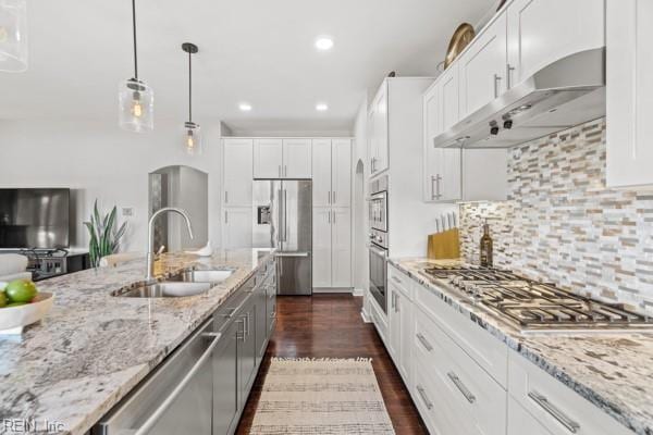 kitchen featuring white cabinetry, stainless steel appliances, sink, and tasteful backsplash