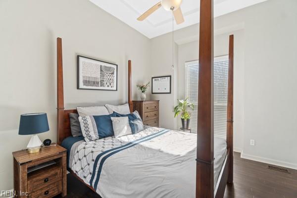 bedroom with dark wood-type flooring and ceiling fan