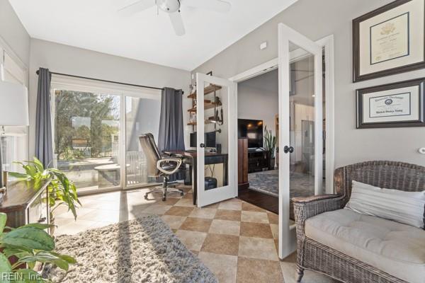 sitting room with french doors and ceiling fan