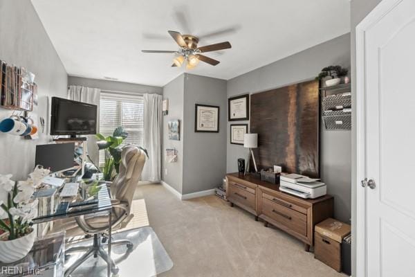 office featuring light carpet and ceiling fan