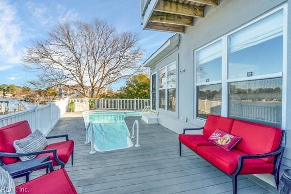 wooden terrace with a fenced in pool