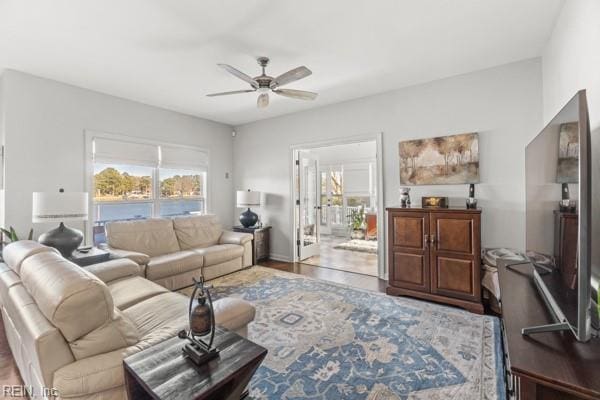 living room featuring hardwood / wood-style flooring and ceiling fan