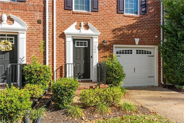 view of exterior entry featuring a garage