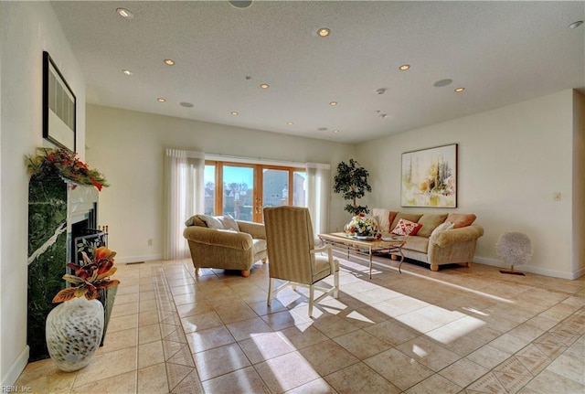 tiled living room with french doors and a premium fireplace