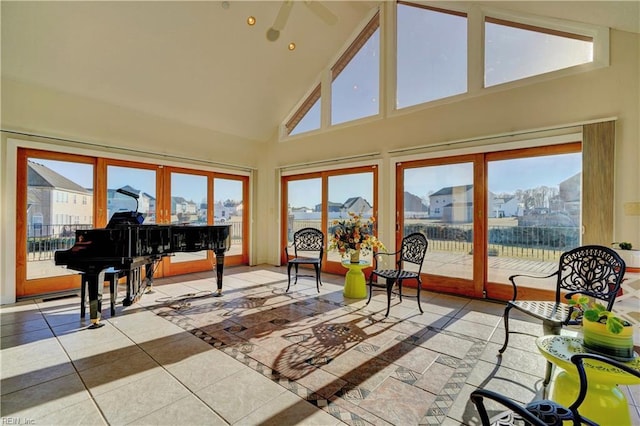 sunroom / solarium featuring vaulted ceiling and french doors