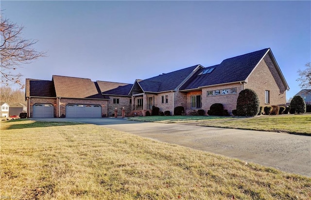 view of front of home with a garage and a front yard