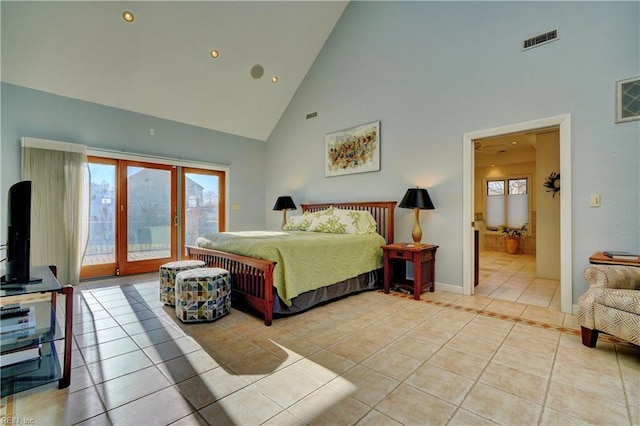 bedroom featuring light tile patterned floors, access to outside, high vaulted ceiling, and french doors